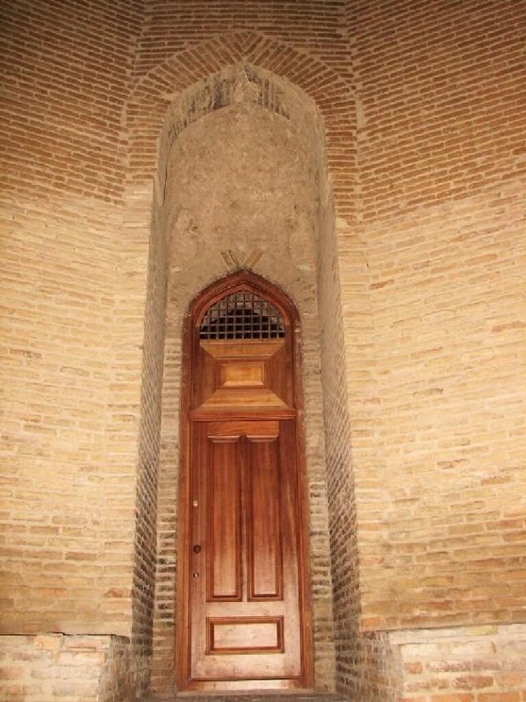 A view of the entrance of Qabus Ibn Voshmgir Historical Tower and its beautiful door