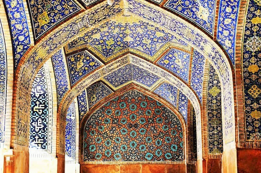 view of tilework decorations in Shah Mosque in Isfahan