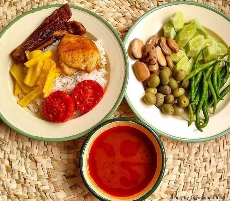 side dishes including chili peppers, pickled beans and cucumbers