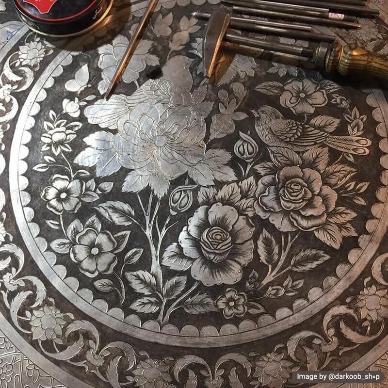 Metal carving artists use different tools to carve on metal