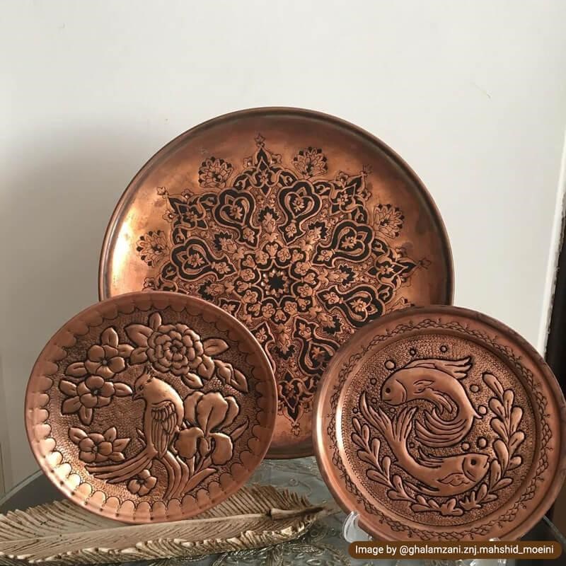 Traditional toreutics patterns on copper trays